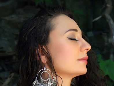 Auresia Explores Her Ukrainian Roots In “Raíces” Music Video